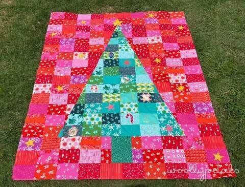 Woollypetals Oh Christmas Tree quilt in pink, red, and turquoise patchwork