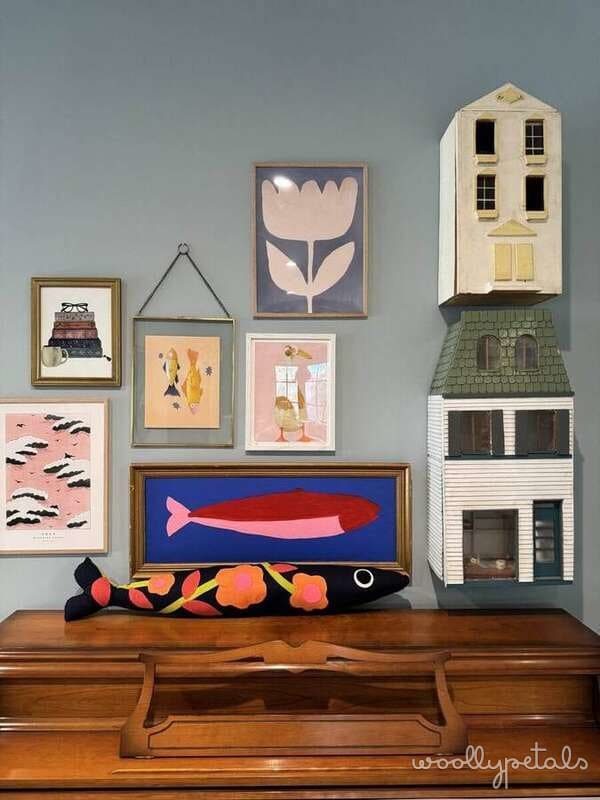 Woollypetals Sardine Pillow in black fabric with colorful embroidered details