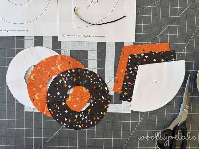 Woollypetals Silly Goose Witch Hat Tutorial fabric pieces on cutting mat with scissors