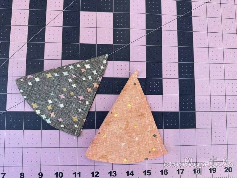 Woollypetals Silly Goose Witch Hat Tutorial showing two finished fabric hat pieces on a cutting mat