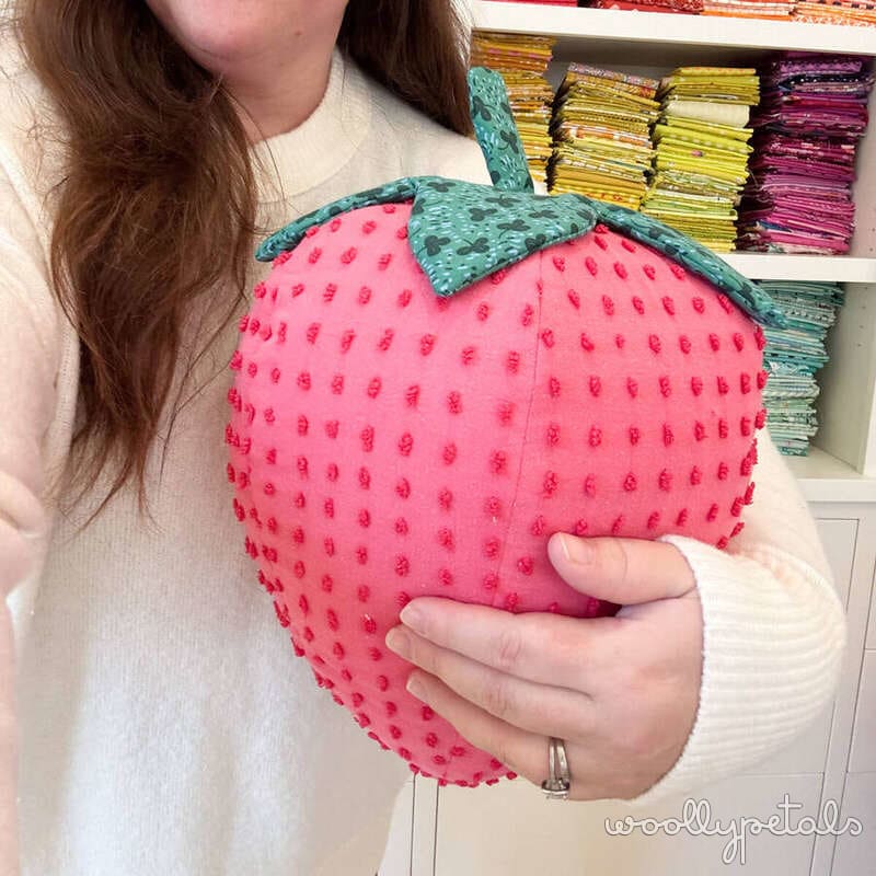 Woollypetals Strawberry Pillow in bright pink with textured details