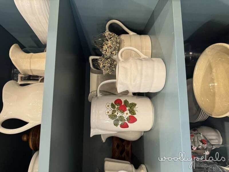 Woollypetals Strawberry Pillow Pattern in white ceramic pitcher with strawberry design