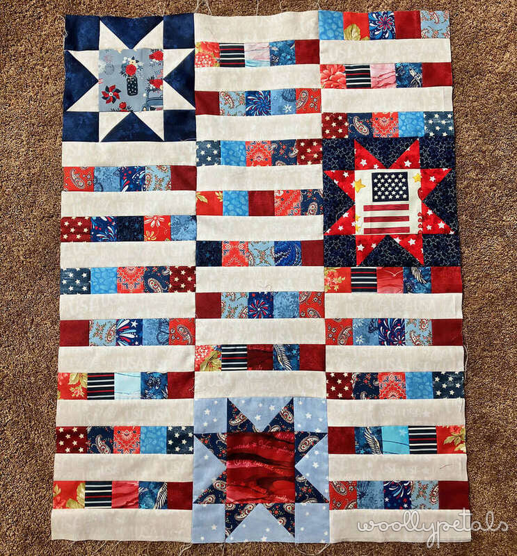 Woollypetals StarBeam quilt in red, white, and blue patriotic fabrics with stars