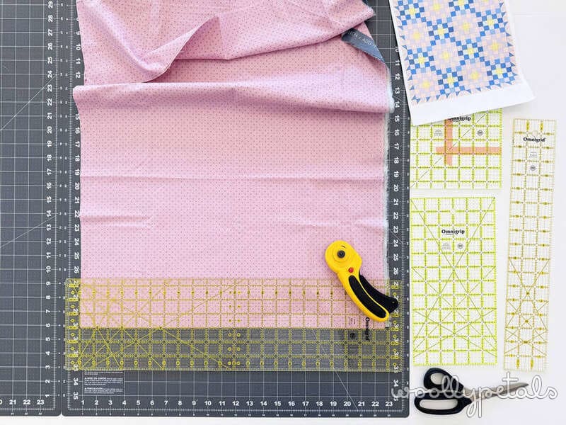 Woollypetals New Star Beginner Quilt Course Week 2 cutting setup with pink fabric and rulers