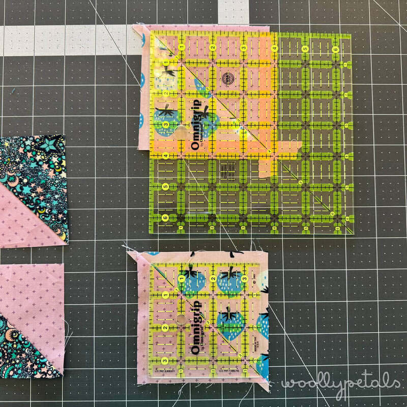 Woollypetals New Star quilt rulers and fabric pieces on cutting mat