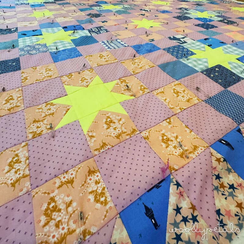 Woollypetals New Star quilt layout with colorful patchwork squares and neon star blocks