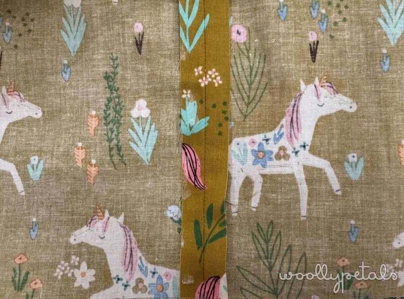 Woollypetals horse quilt backing fabric with tan linen, floral motifs, and gold stripe