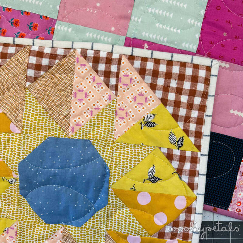Woollypetals New Star Beginner Quilt Course Week 8 binding tutorial with colorful fabric squares
