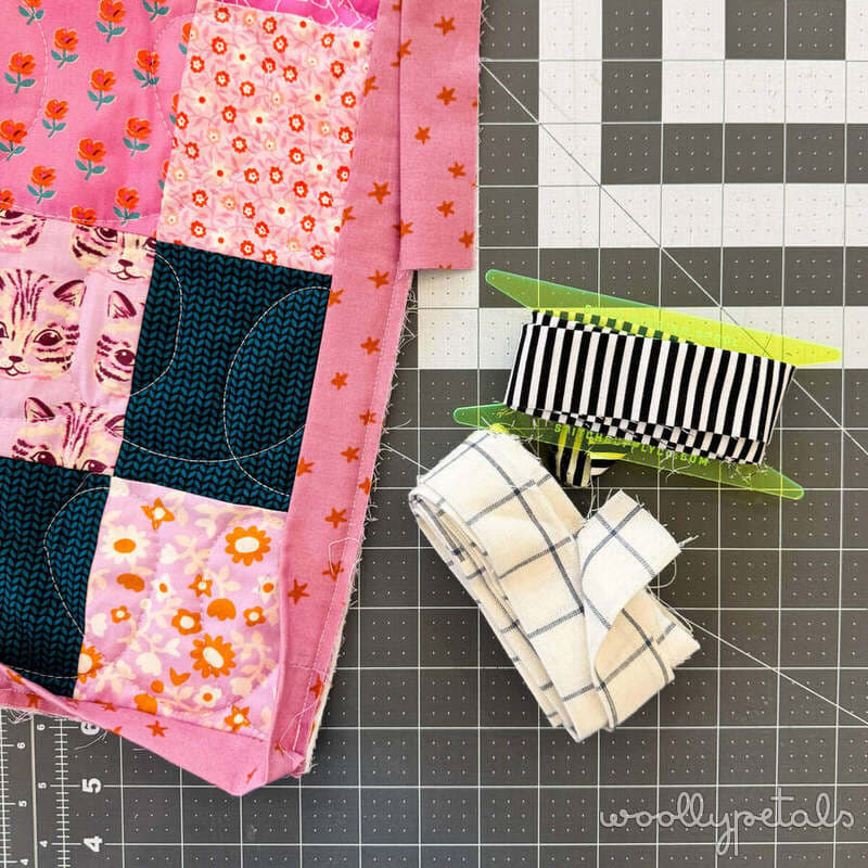 Woollypetals New Star Beginner Quilt Course Week 8 binding tutorial with fabric strips and ruler