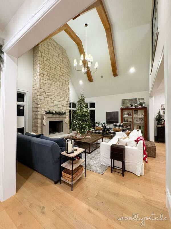 Woollypetals House Tour living room with vaulted ceilings and fireplace
