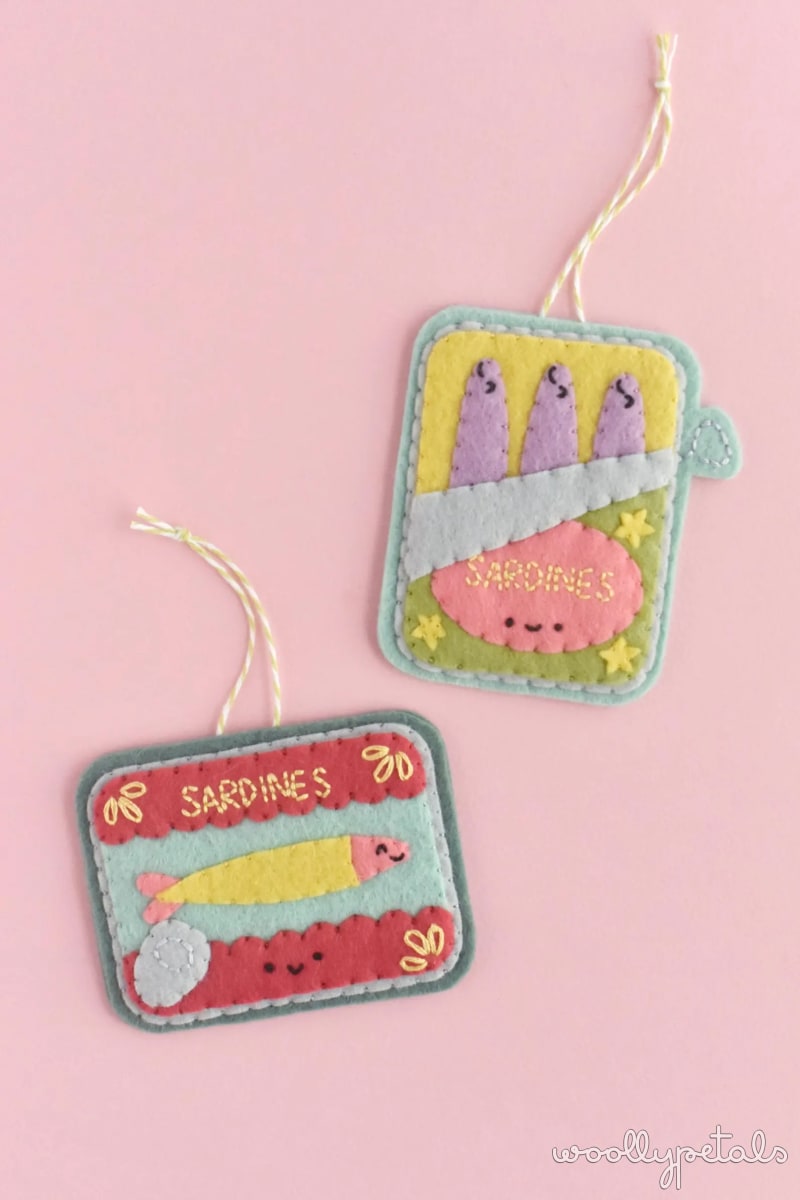 Woollypetals Sardine felt ornaments in pastel colors on pink background