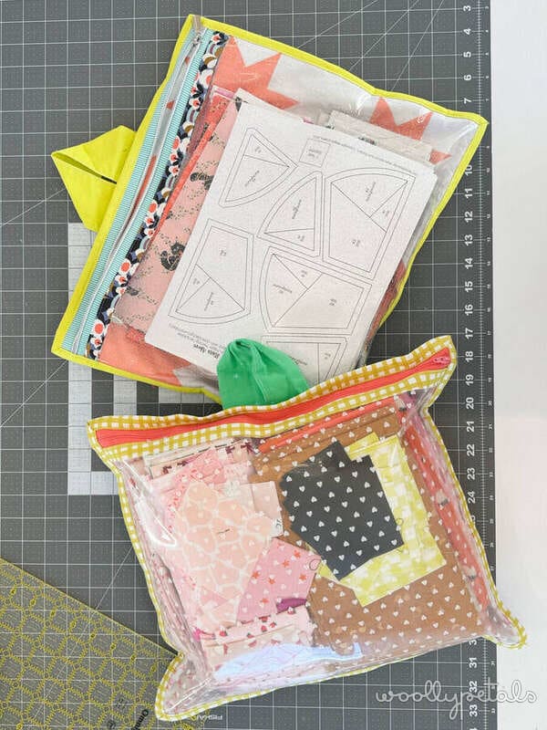 Sewing gift guide flat lay with fabric pouches and quilting patterns on cutting mat