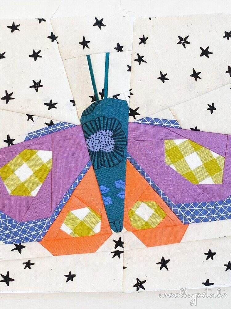 Woollypetals Moth Eclipse FPP pattern with colorful fabric moth on star background