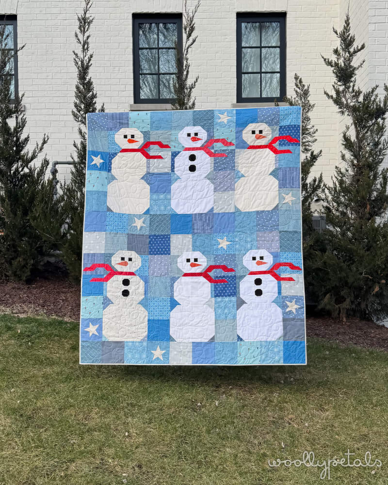 Woollypetals Do You Want to Sew a Snowman Quilt displayed outdoors